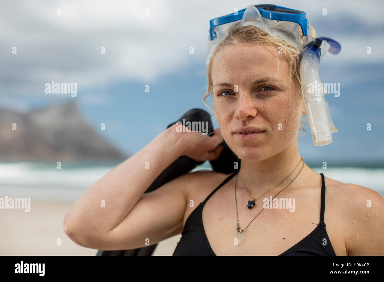 Portrait of young woman with snorkeling equipment on the beach Stock Photo