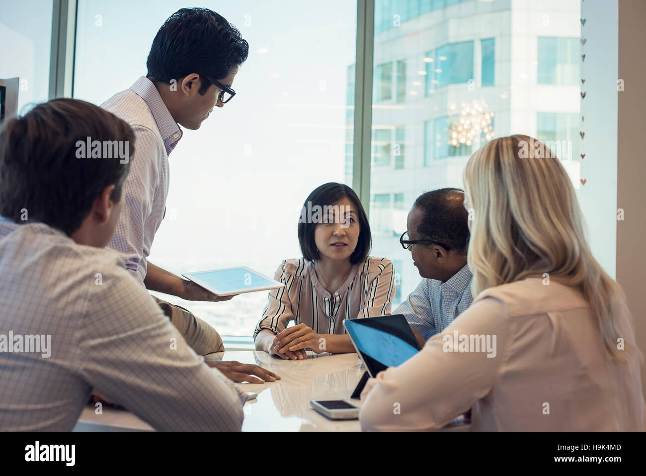 Business people in meeting having interesting discussion Stock Photo