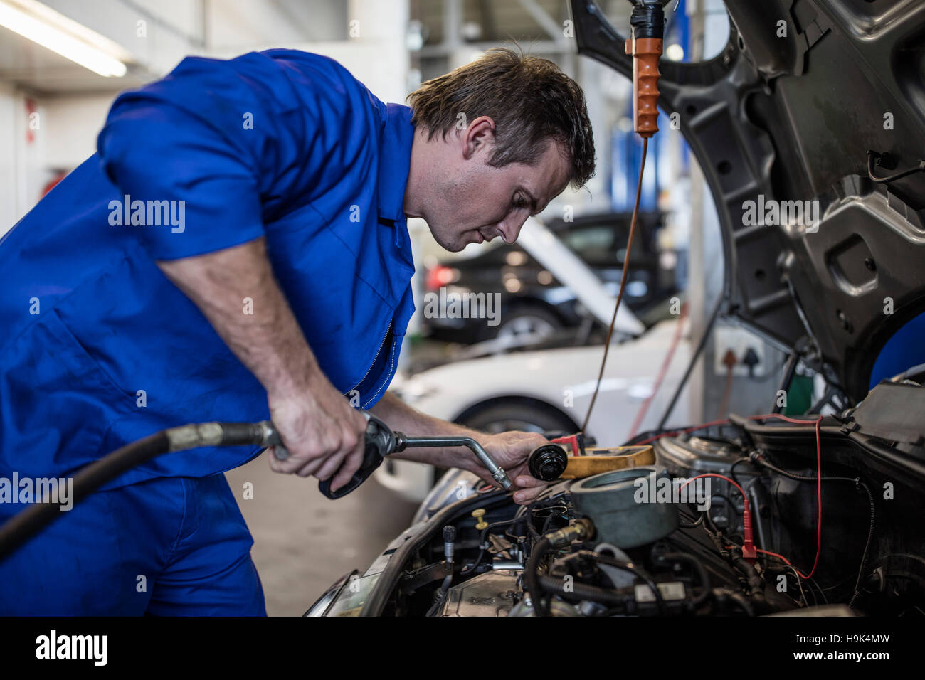 Car mechanic in a repairing car Stock Photo Alamy