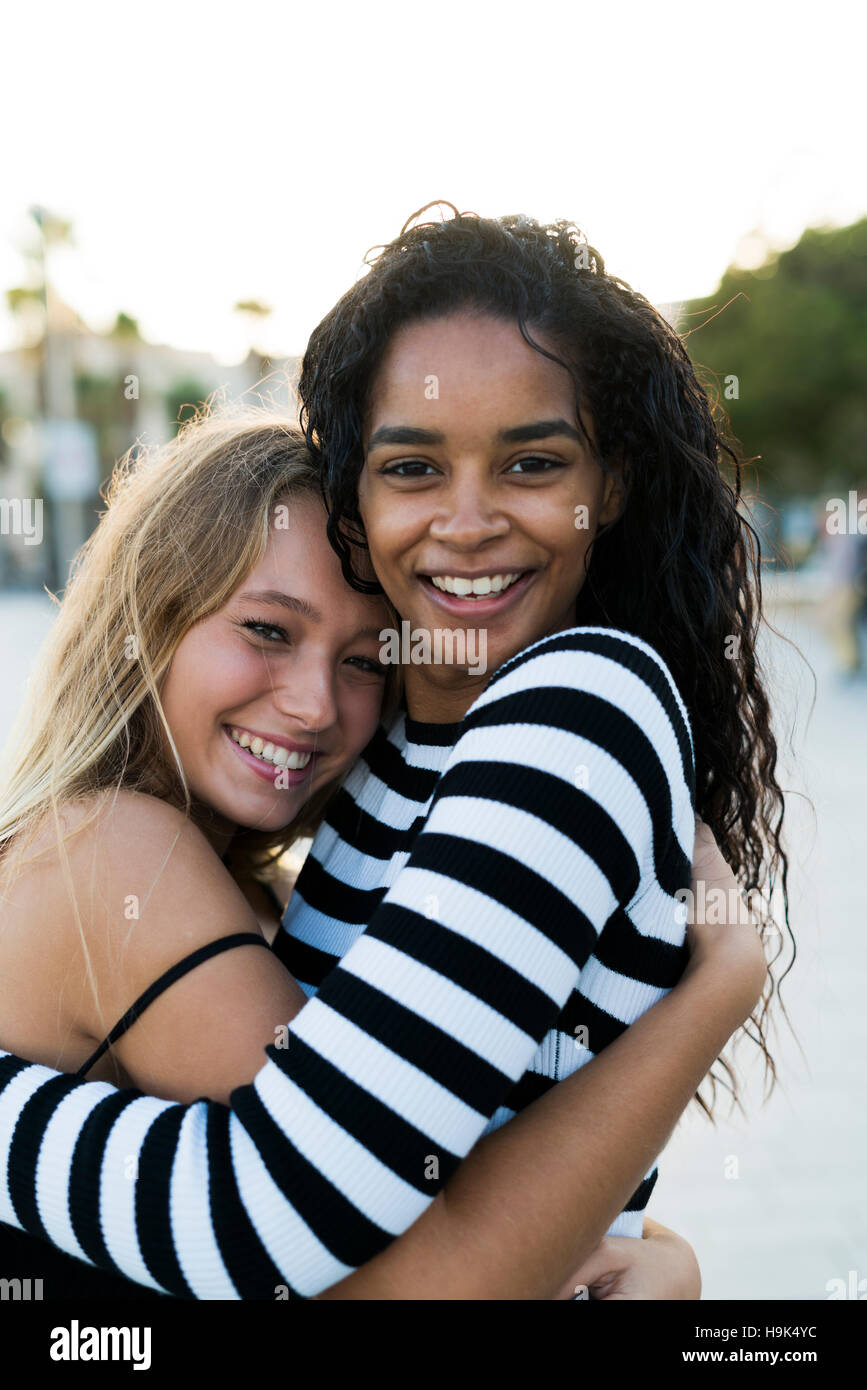 Multicultural women hugging hi-res stock photography and images - Alamy