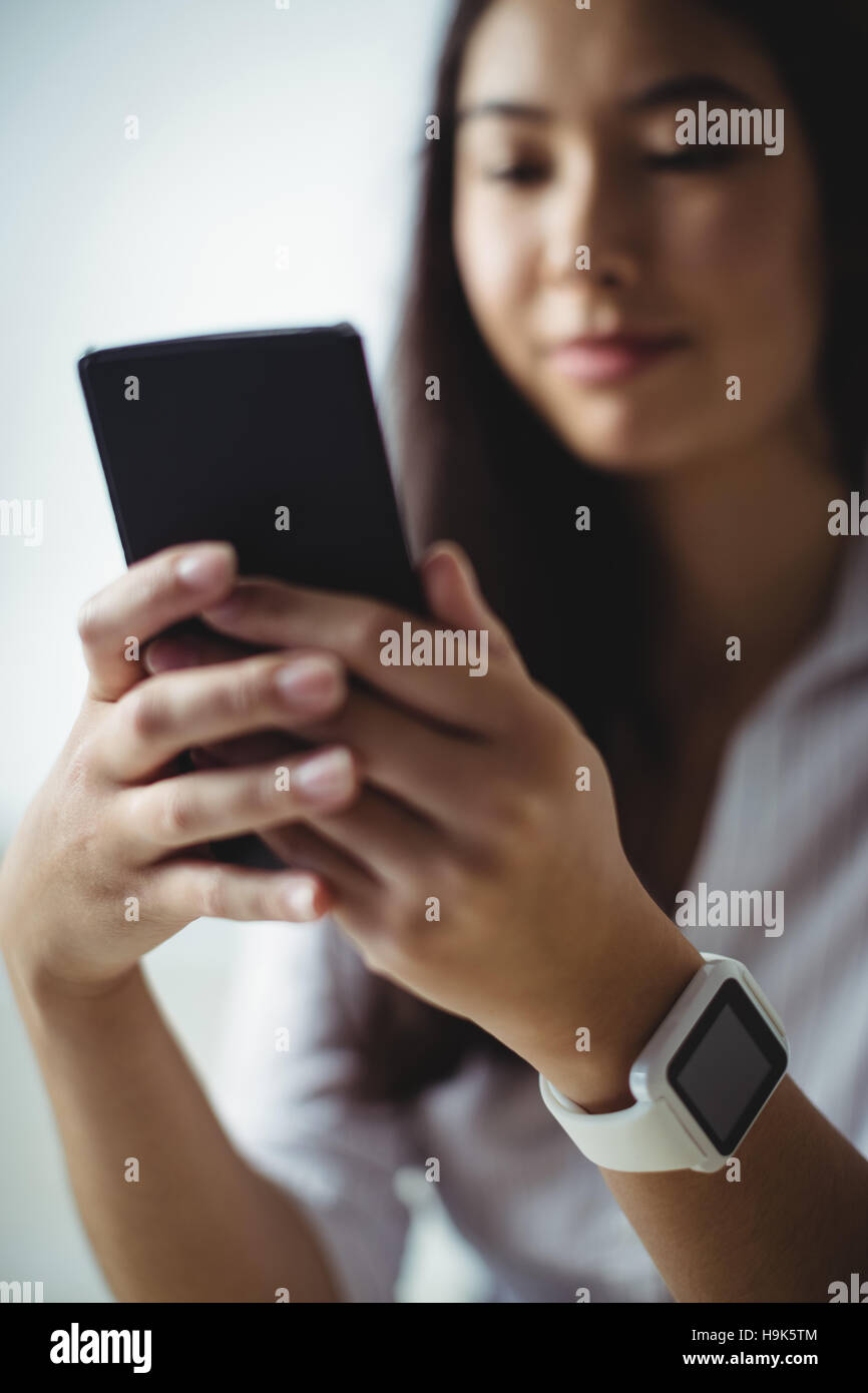 Beautiful woman using smartwatch smartphone hi-res stock photography ...