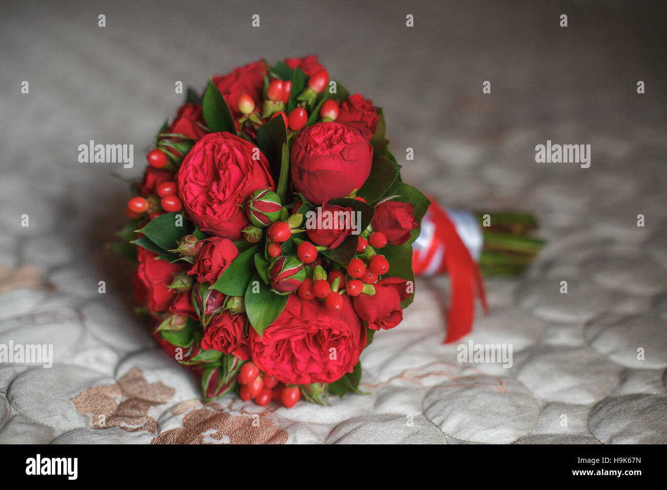 Beautiful wedding bouquet on sofa background Stock Photo