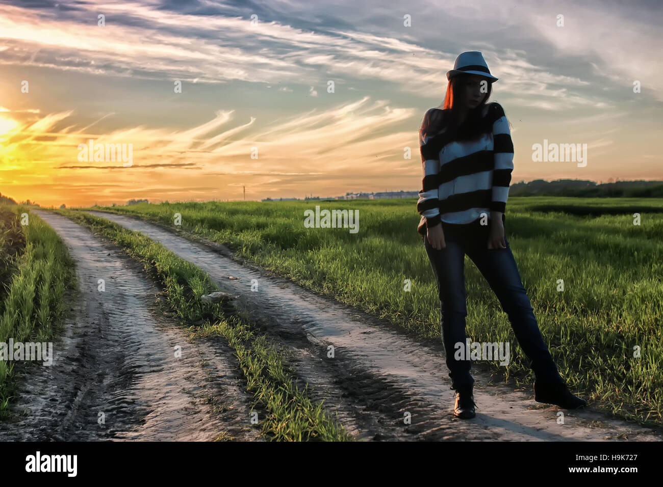 girl fashion in the field on sunset Stock Photo - Alamy