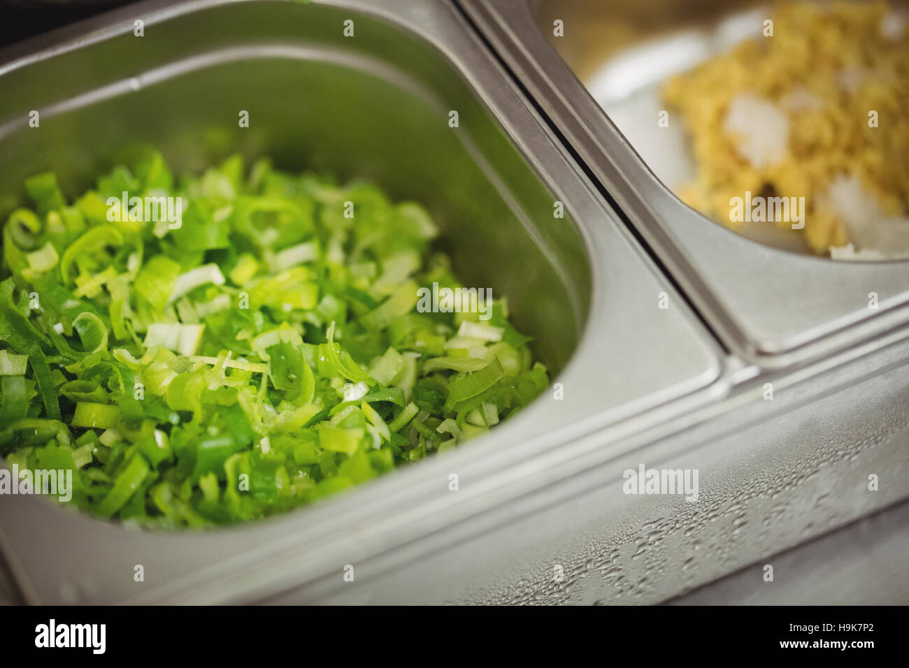 Close-up of chopped leafy vegetable in container Stock Photo