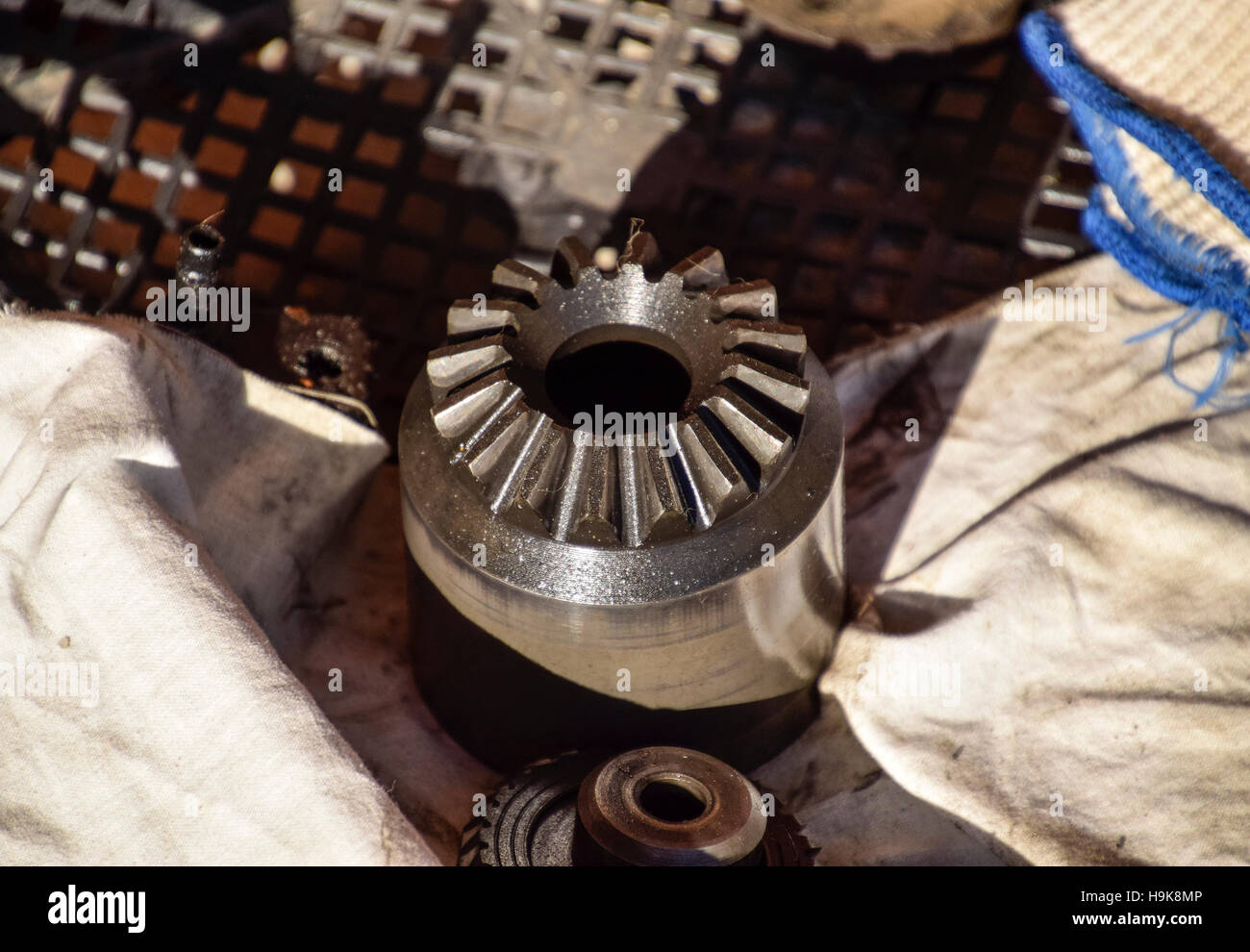 Different cog wheels dismantled from the drive line of a car. Stock Photo
