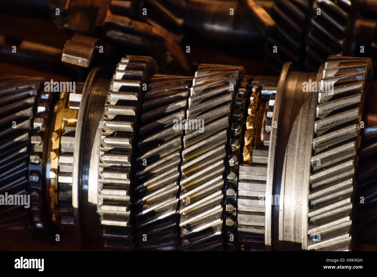 Dismantled box car transmissions. The gears on the shaft of a