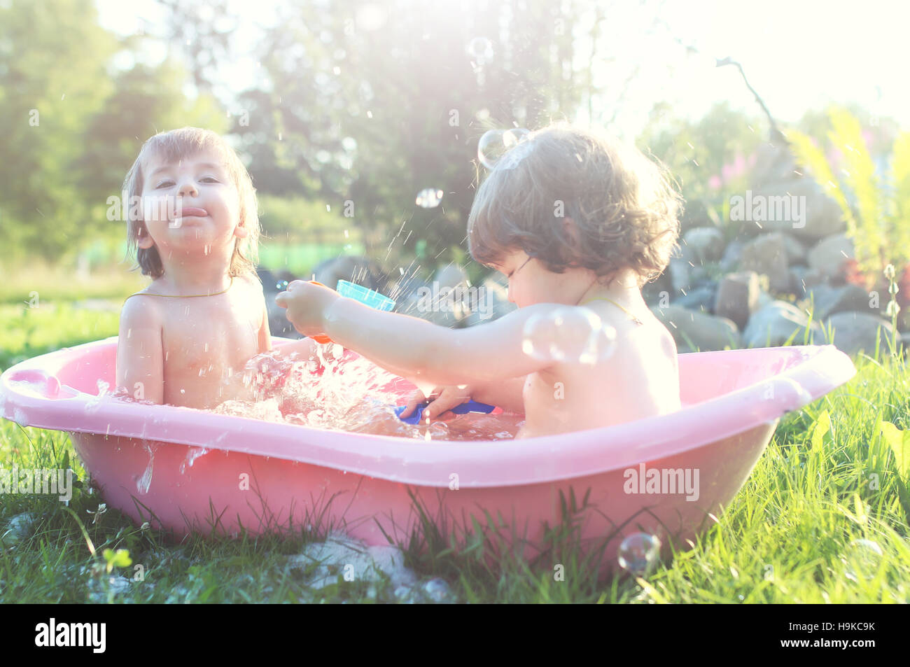kids in bath water outdoor Stock Photo Alamy