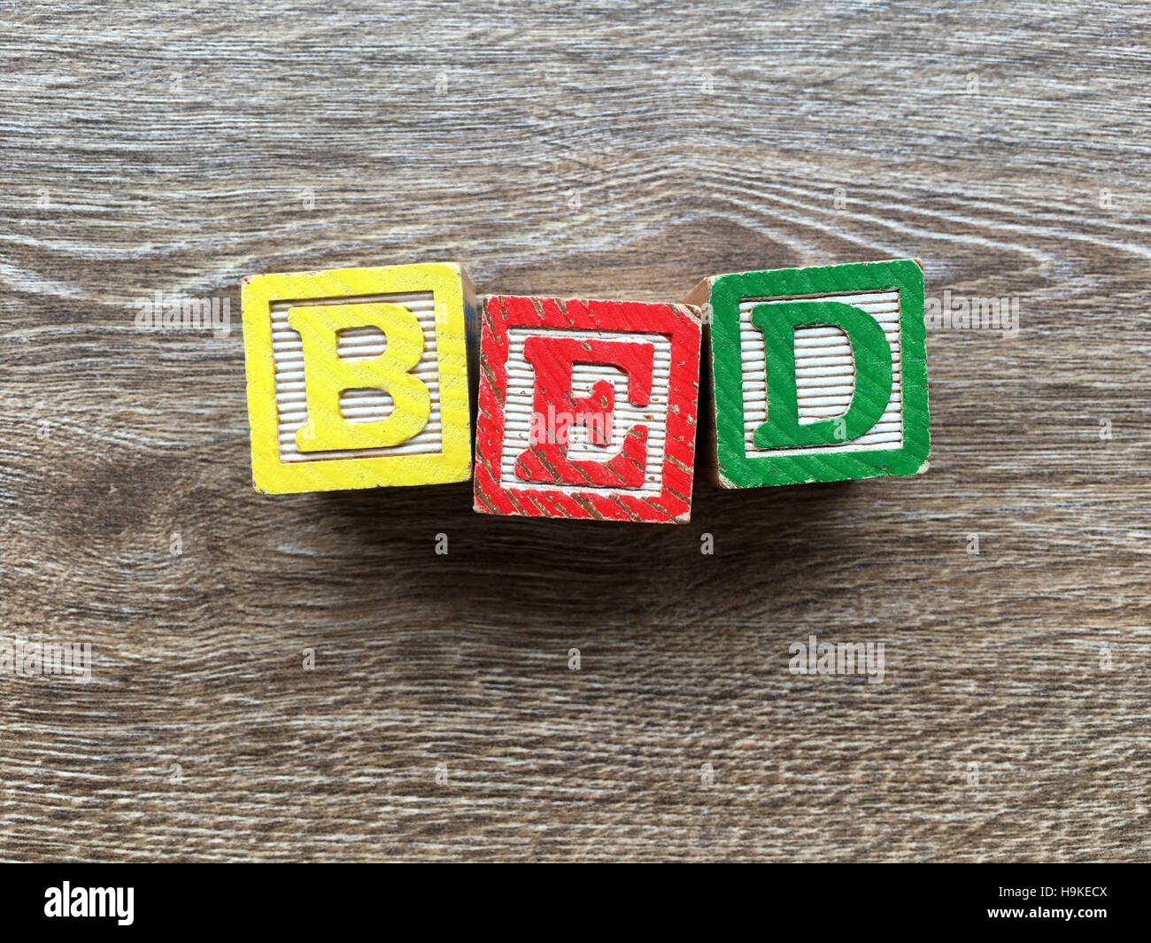 Alphabet wood blocks making the word BED Stock Photo Alamy