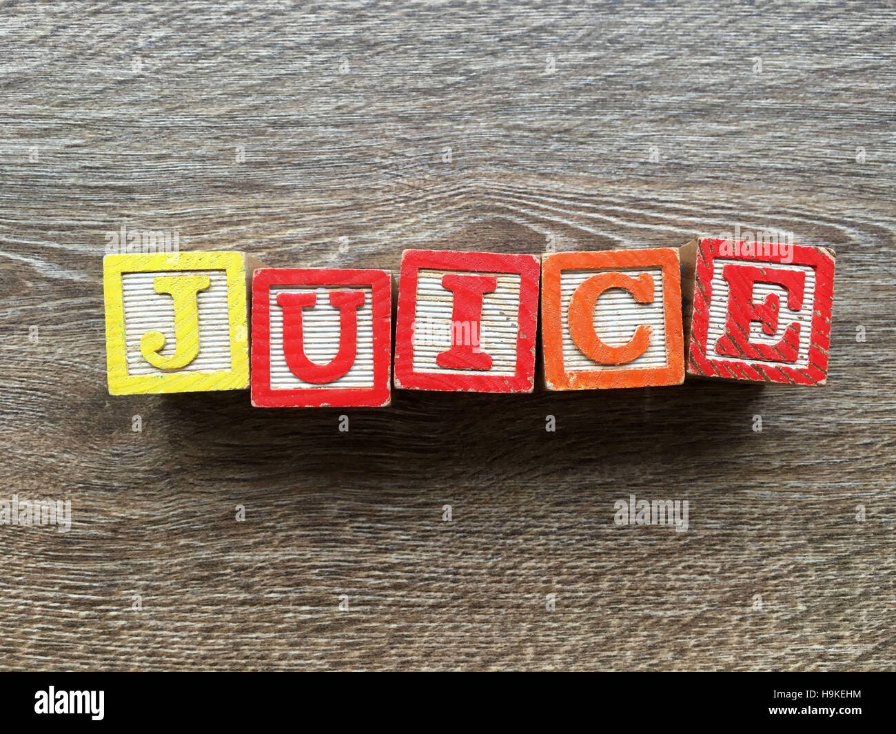 Alphabet wood blocks making the word JUICE Stock Photo Alamy