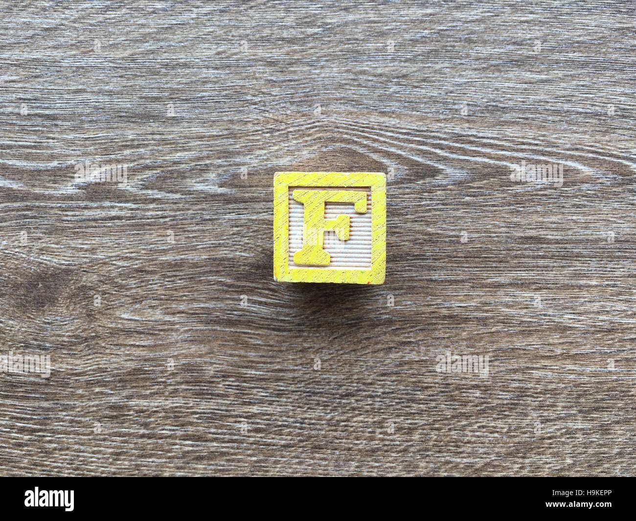 Wood Cube or Block with the F letter Stock Photo