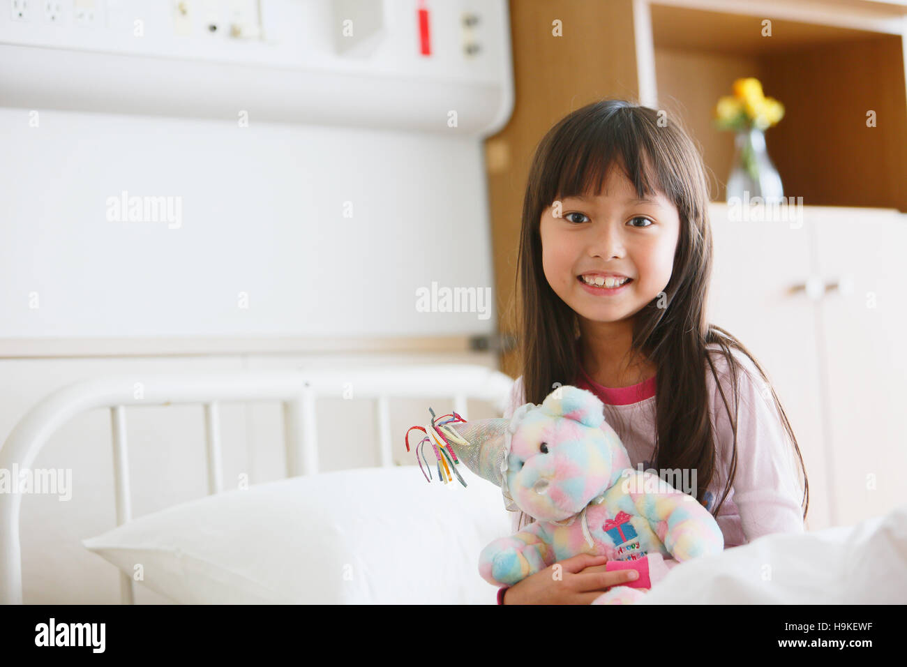 Sick young Japanese girl at the hospital Stock Photo