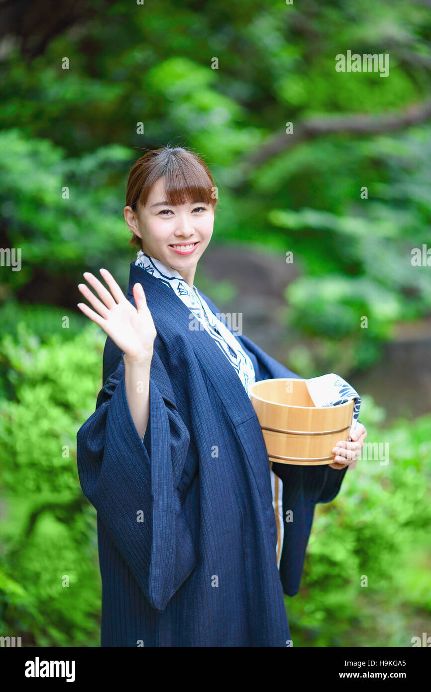 Young Japanese woman wearing yukata at traditional onsen hot spring Stock Photo
