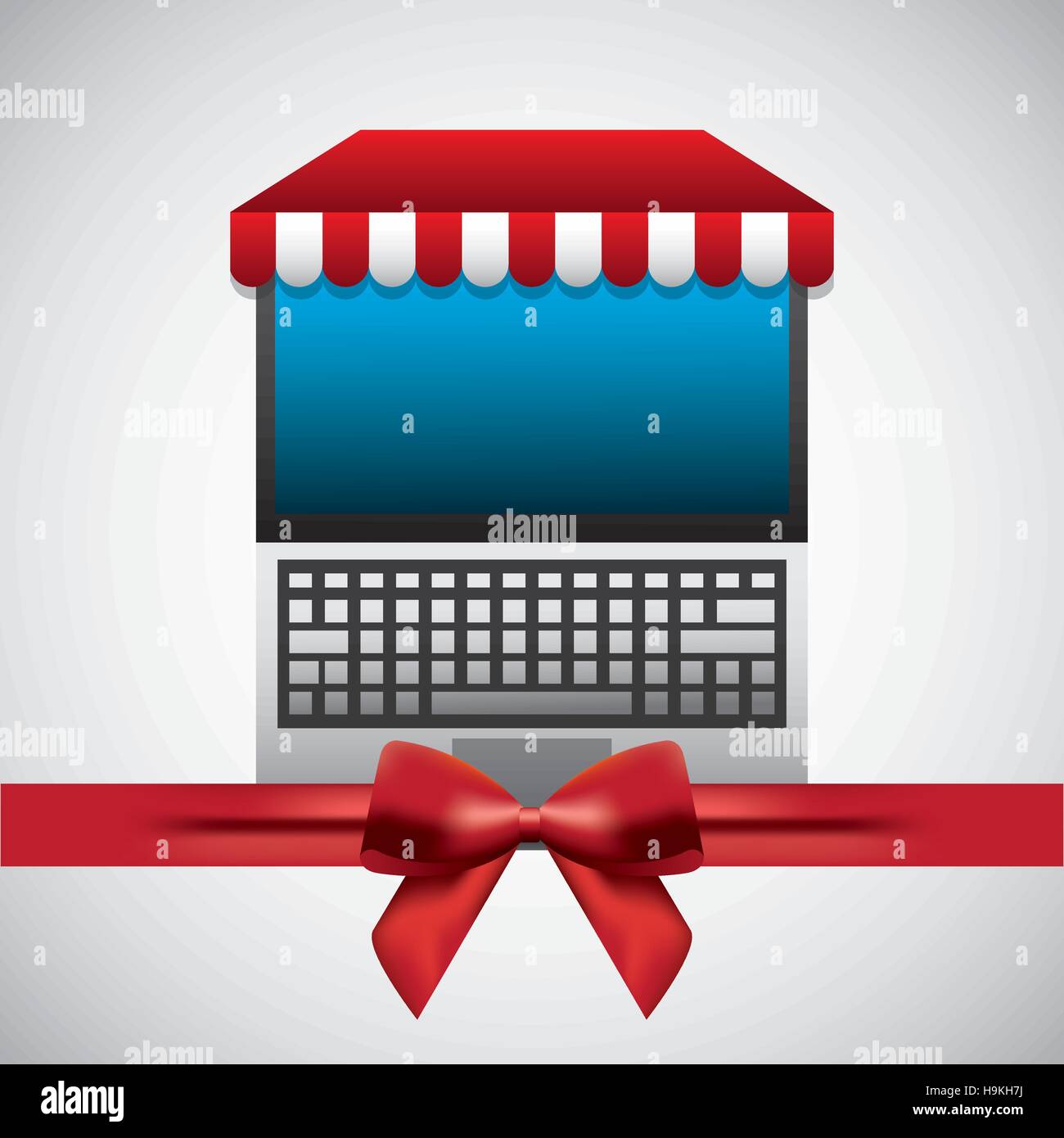 laptop computer device with red ribbon decoration over white background ...