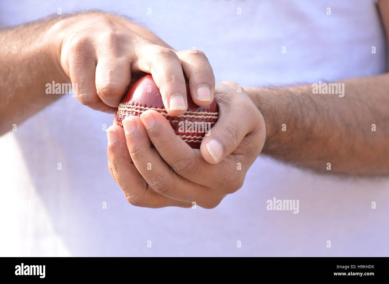 cricket fast bowler going to ball. Stock Photo