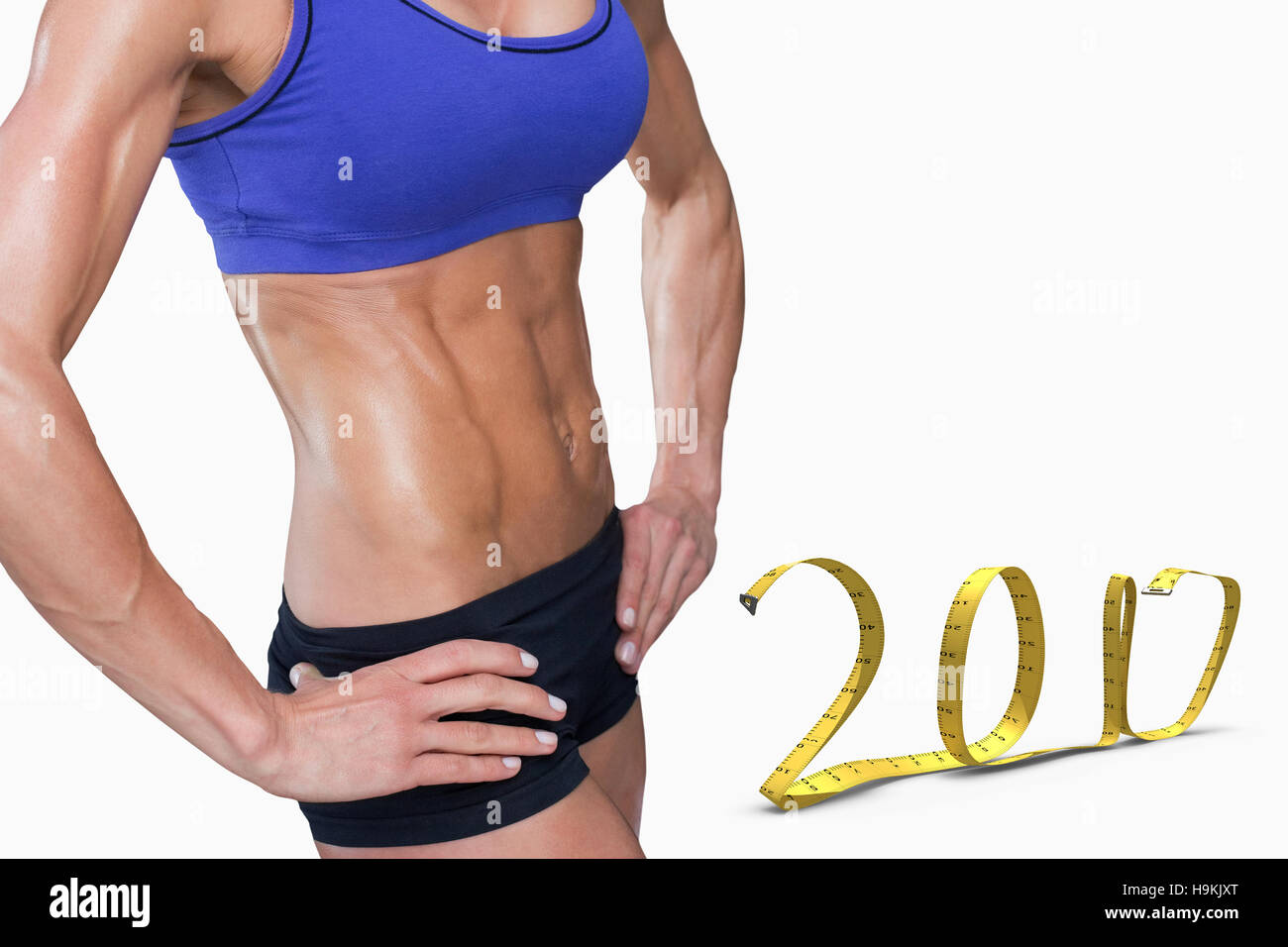 3D Composite image of midsection of fit woman with hand on hip Stock Photo