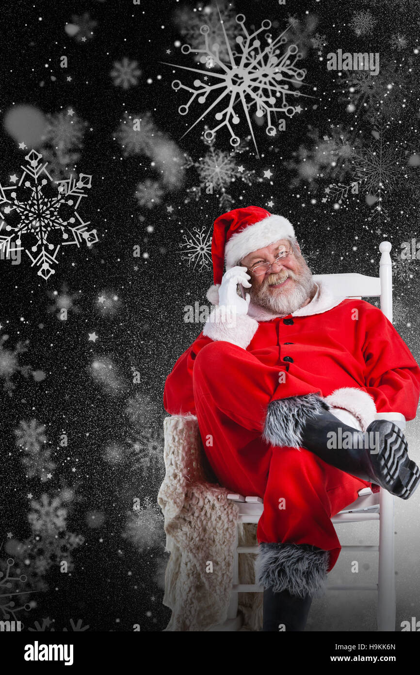 Composite image of santa claus talking on mobile phone Stock Photo