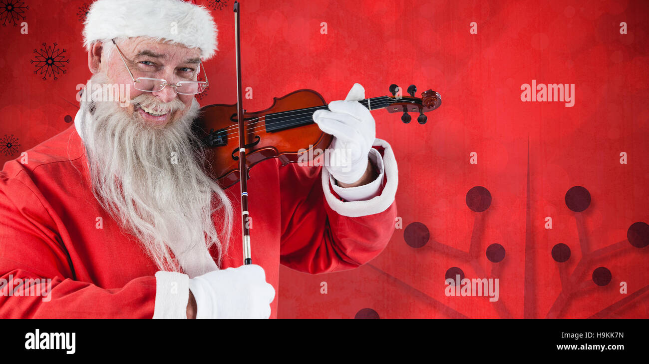 Composite image of portrait of santa claus playing violin Stock Photo