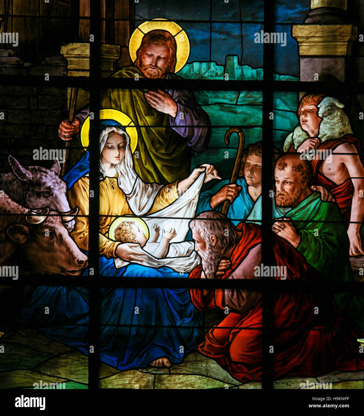 Nativity Scene at Christmas. Stained glass window in the German Church