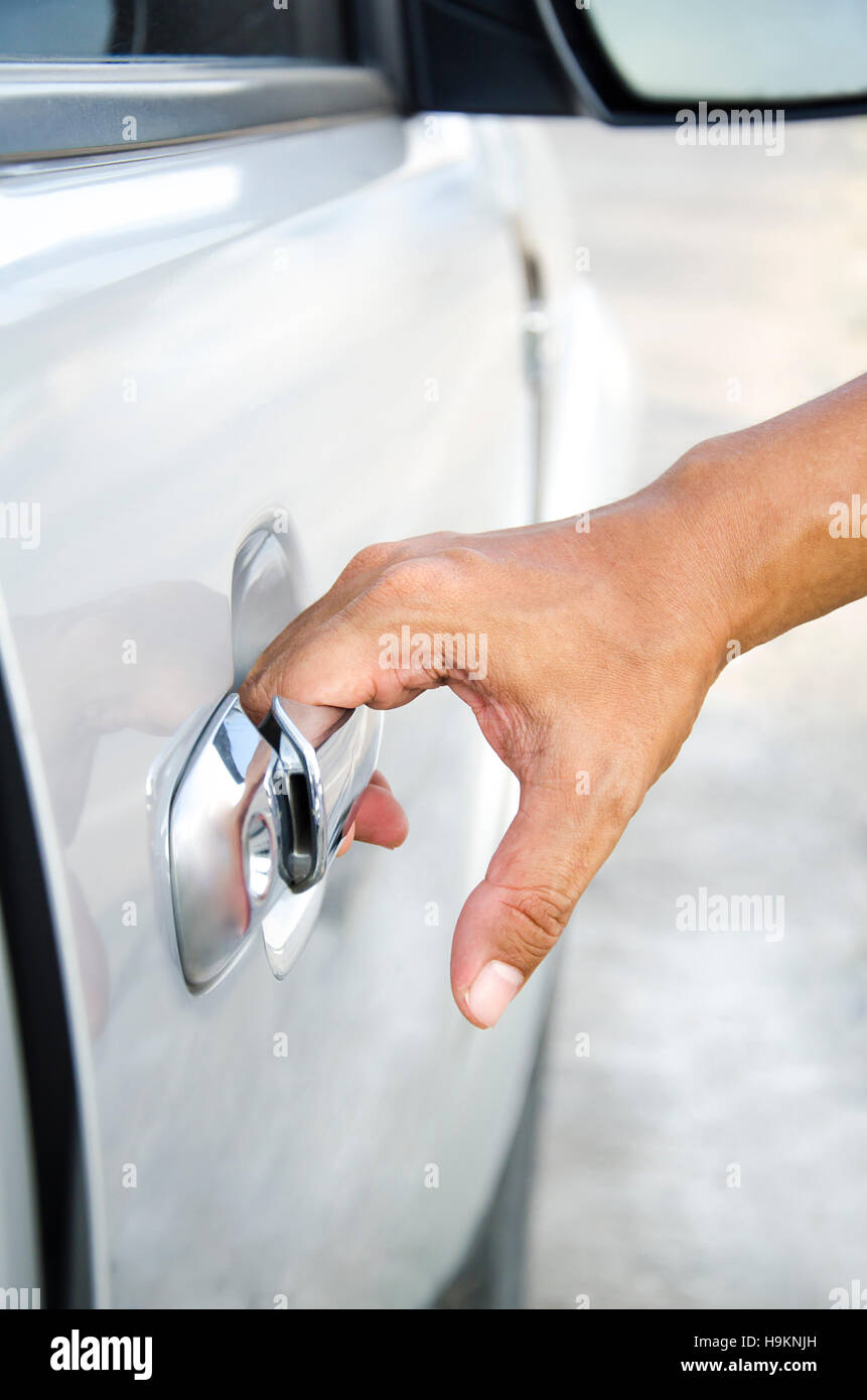 Closeup of man hand opening a car door Stock Photo