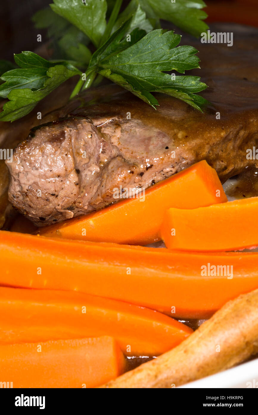 A meal of Scottish Venison Rump Steak with potatoes, vegetables and gravy served in a giant Yorkshire Pudding. Stock Photo