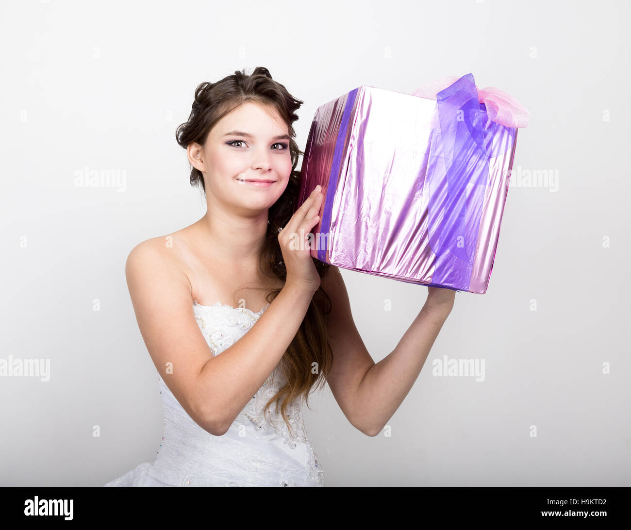 Portrait of young happy woman with gift box in hands Stock Photo - Alamy