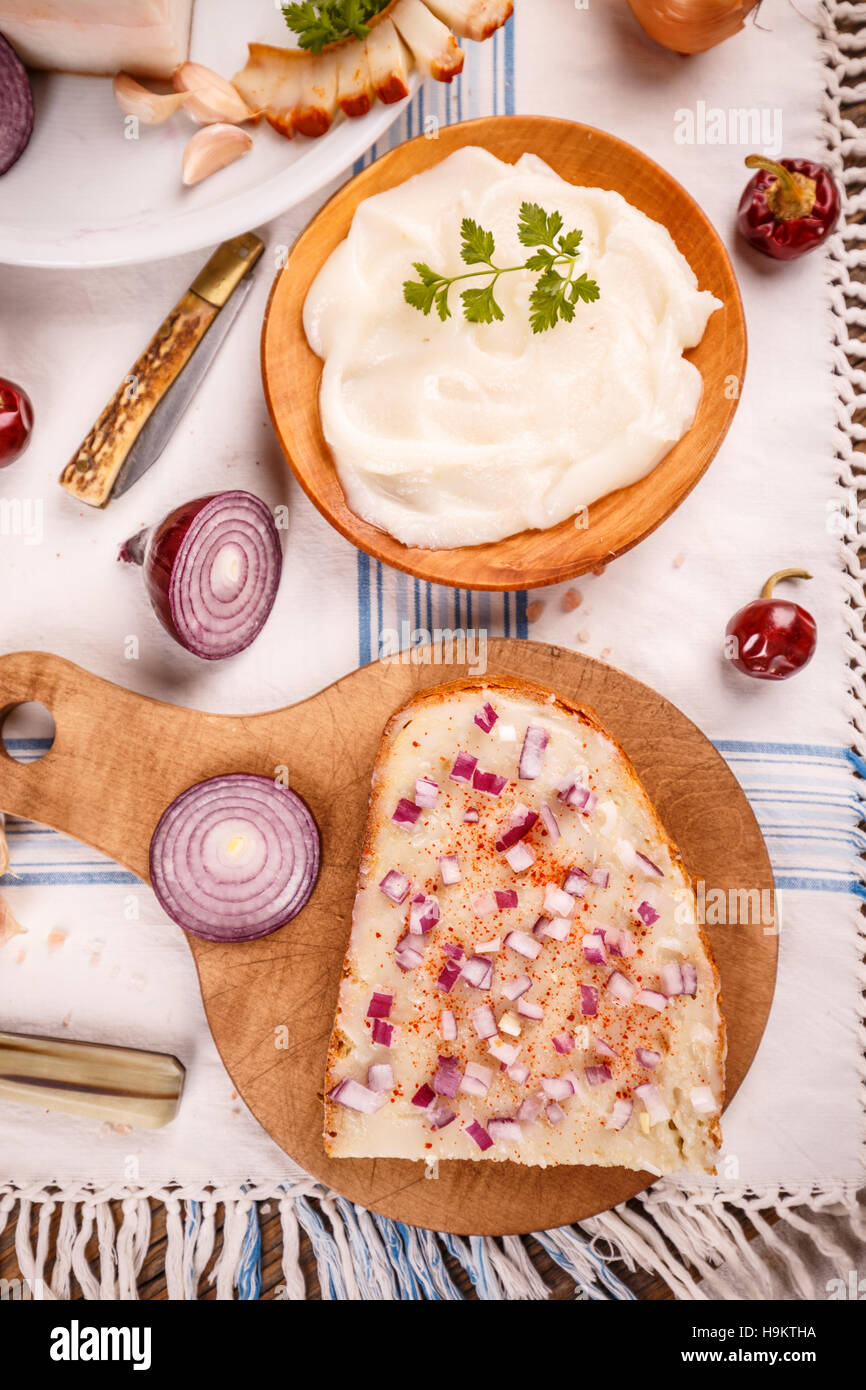 Lard bread with red paprika powder on rustic table Stock Photo Alamy