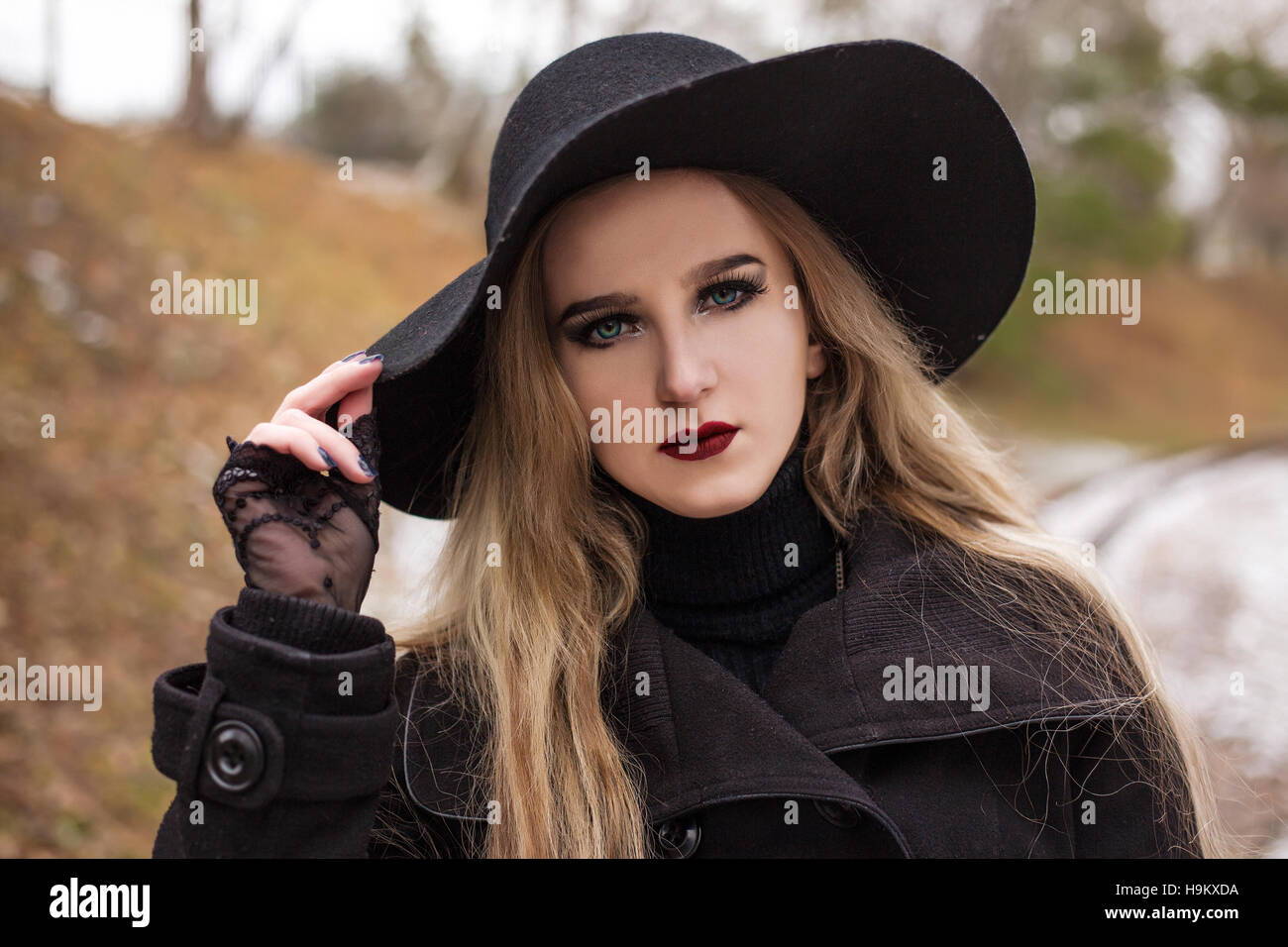 Portrait of a young beautiful woman in black hat retro style Stock ...