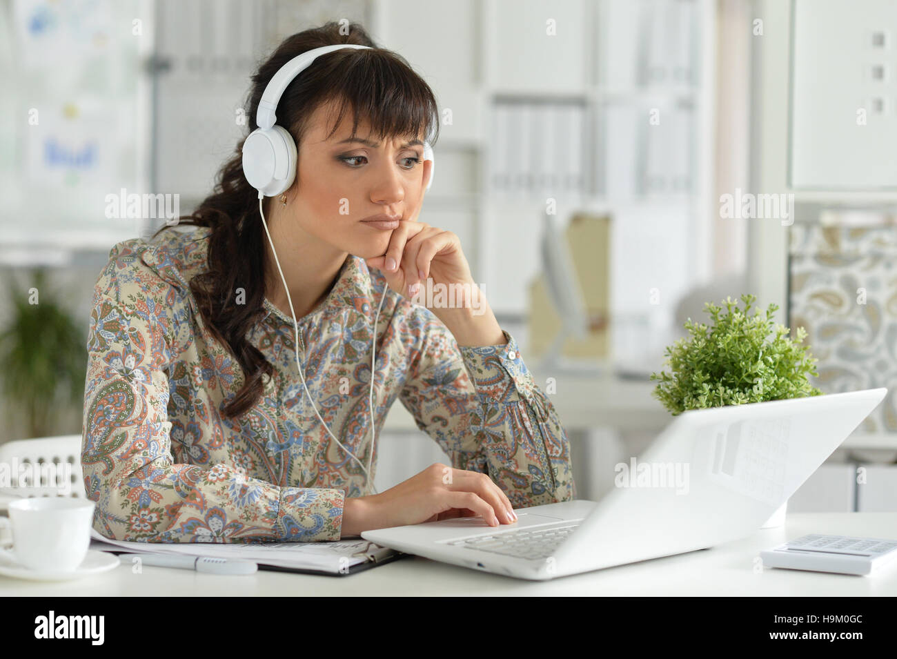 Young businesswoman with headphones Stock Photo - Alamy