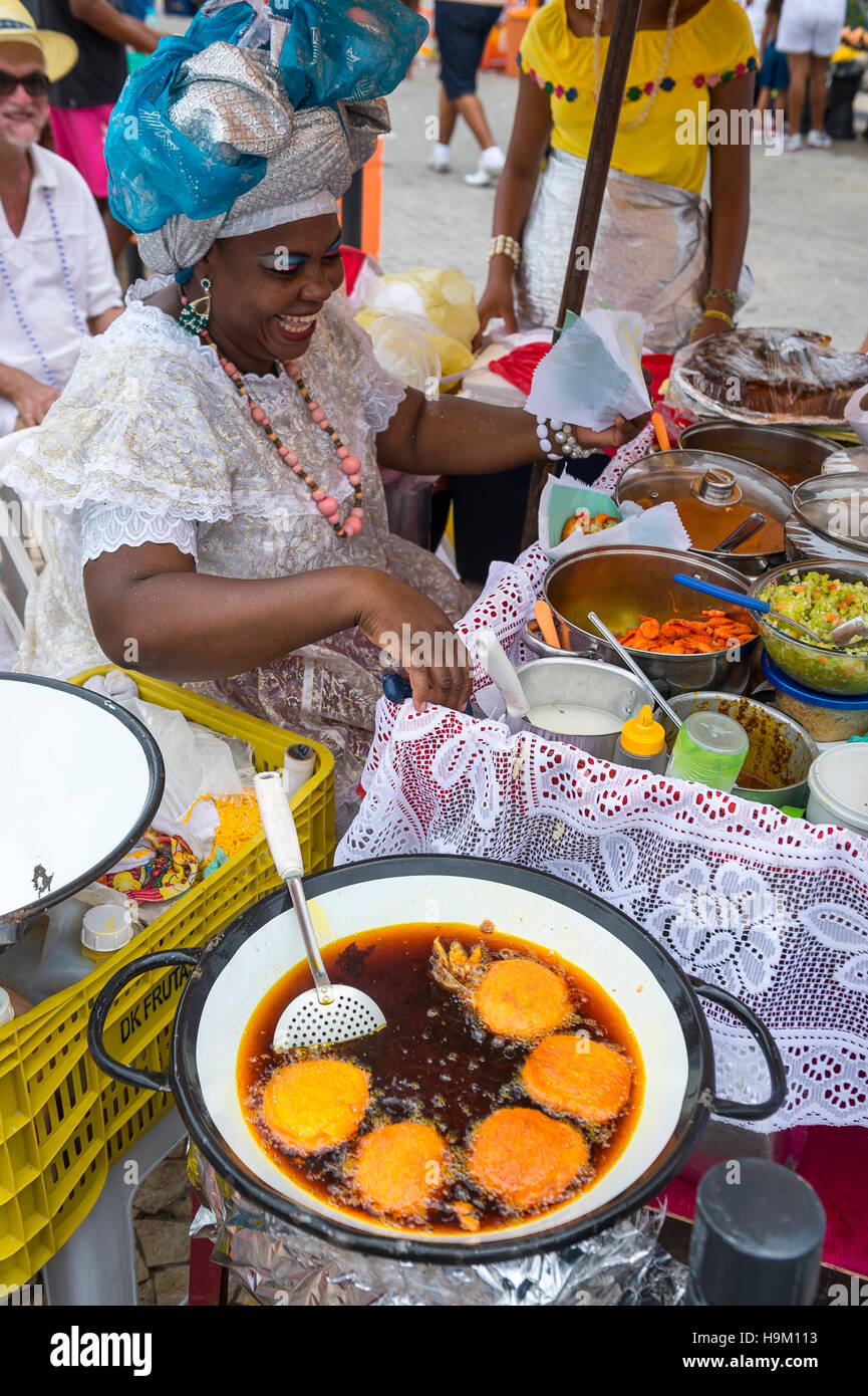 SALVADOR, BRAZIL - FEBRUARY 02, 2016: Brazilian Baiana woman assembles ...