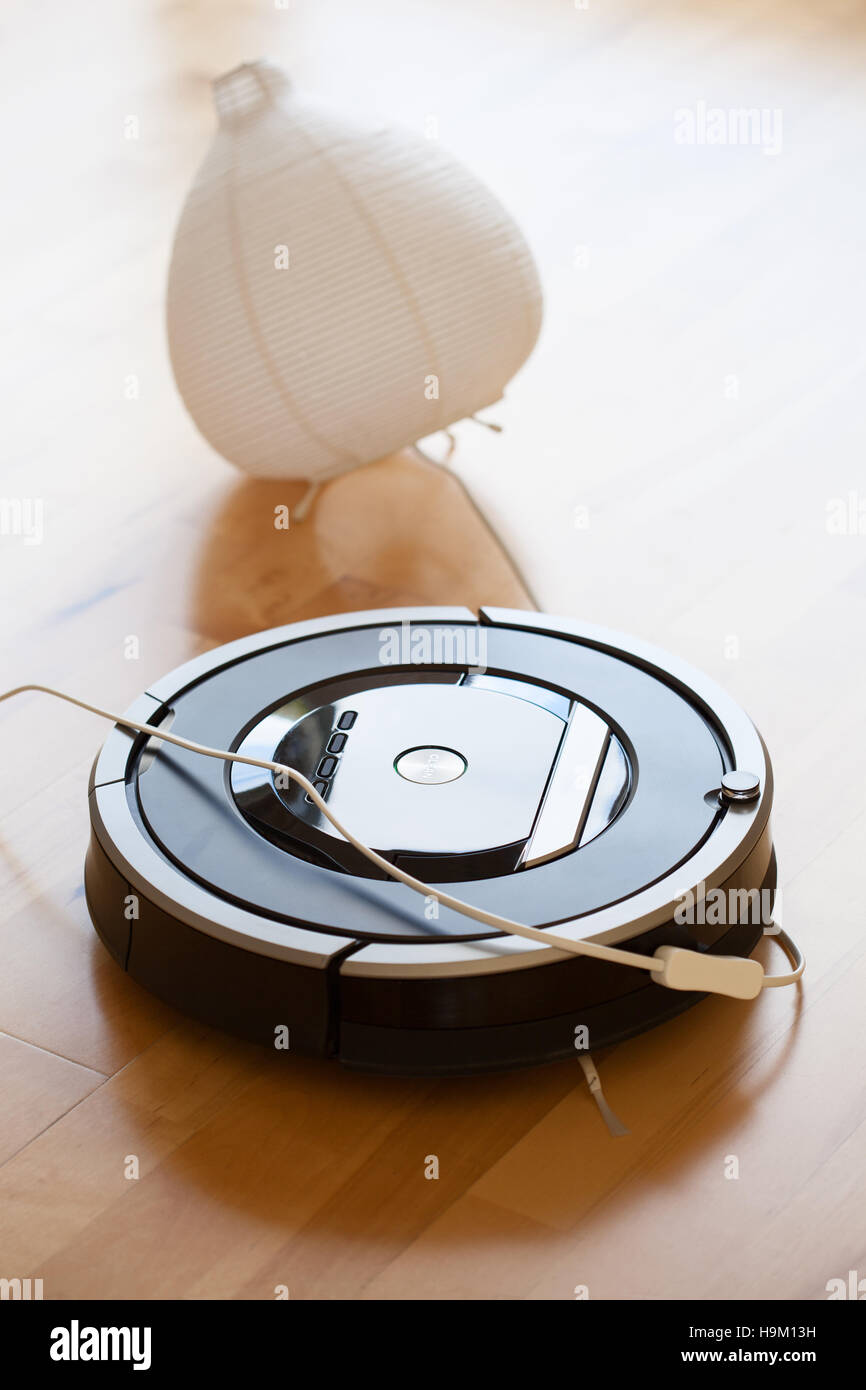 robotic vacuum cleaner on laminate wood floor smart cleaning technology