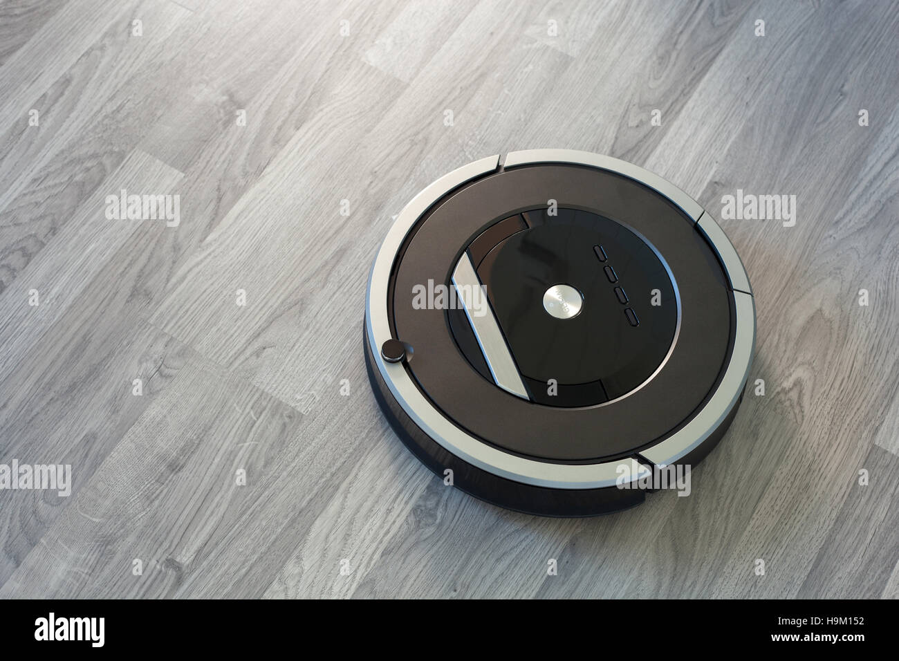 Robotic Vacuum Cleaner On Laminate Wood Floor Smart Cleaning Stock