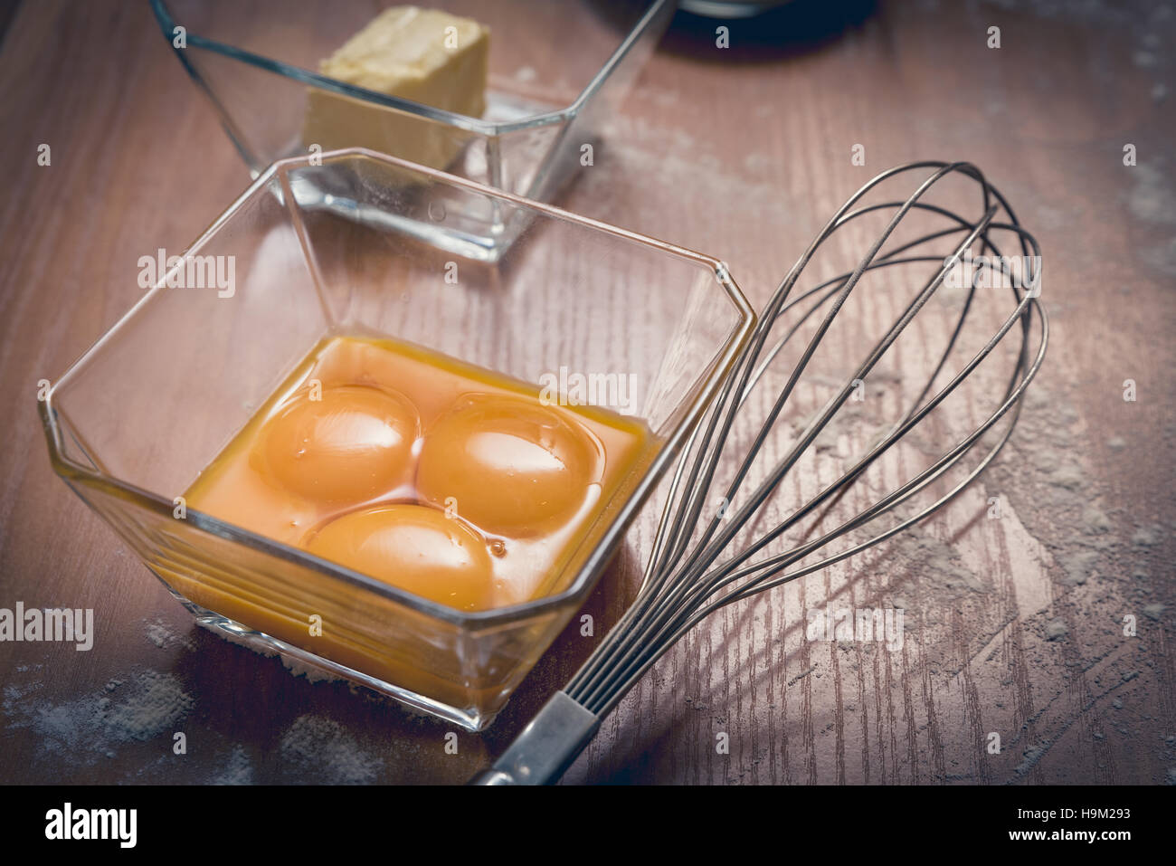 cake ingredients, egg beater, eggs, cream and flour. Cake baking concept Stock Photo
