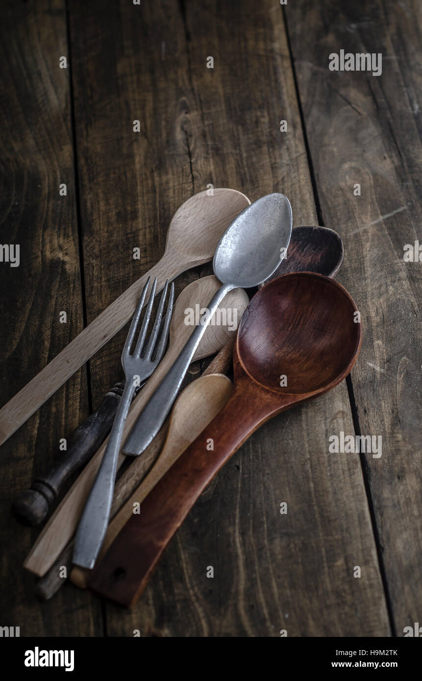 Vintage cutlery props in dark background, from above Stock Photo
