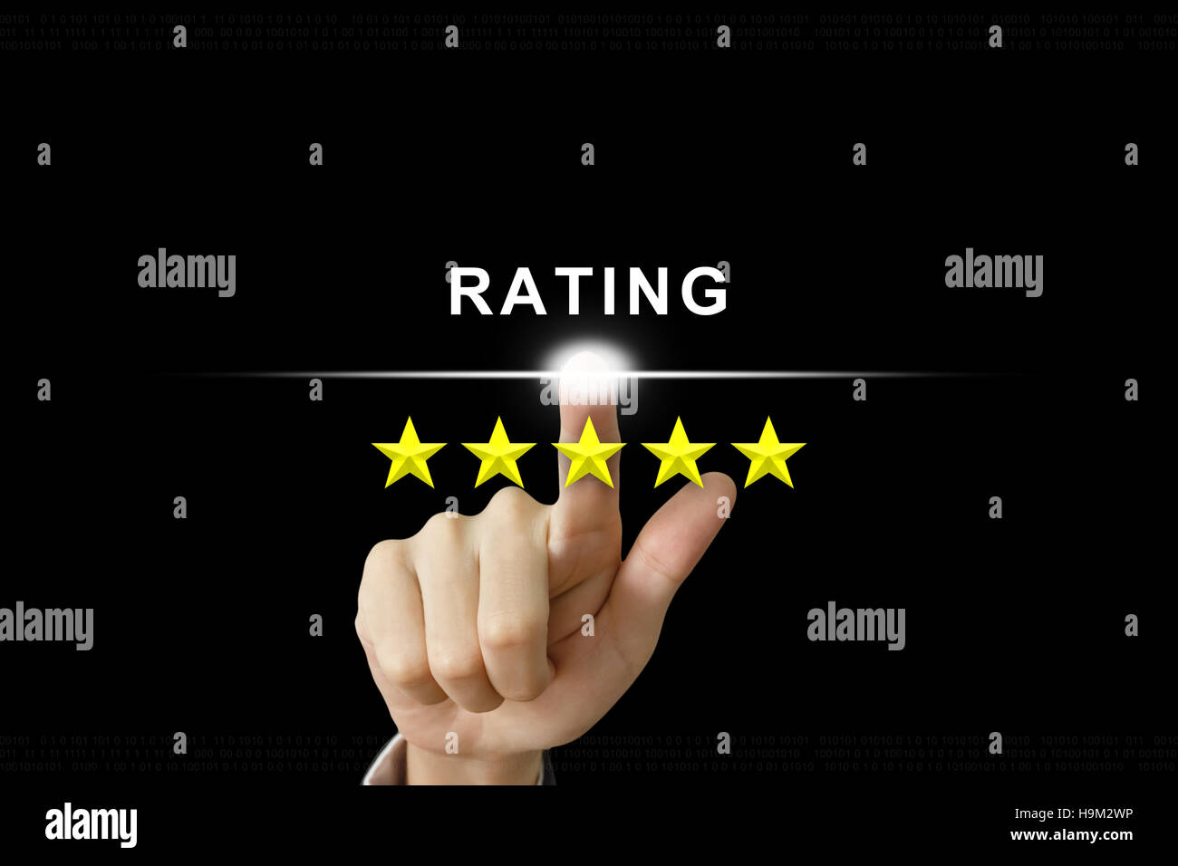 business hand clicking rating with five stars on screen Stock Photo
