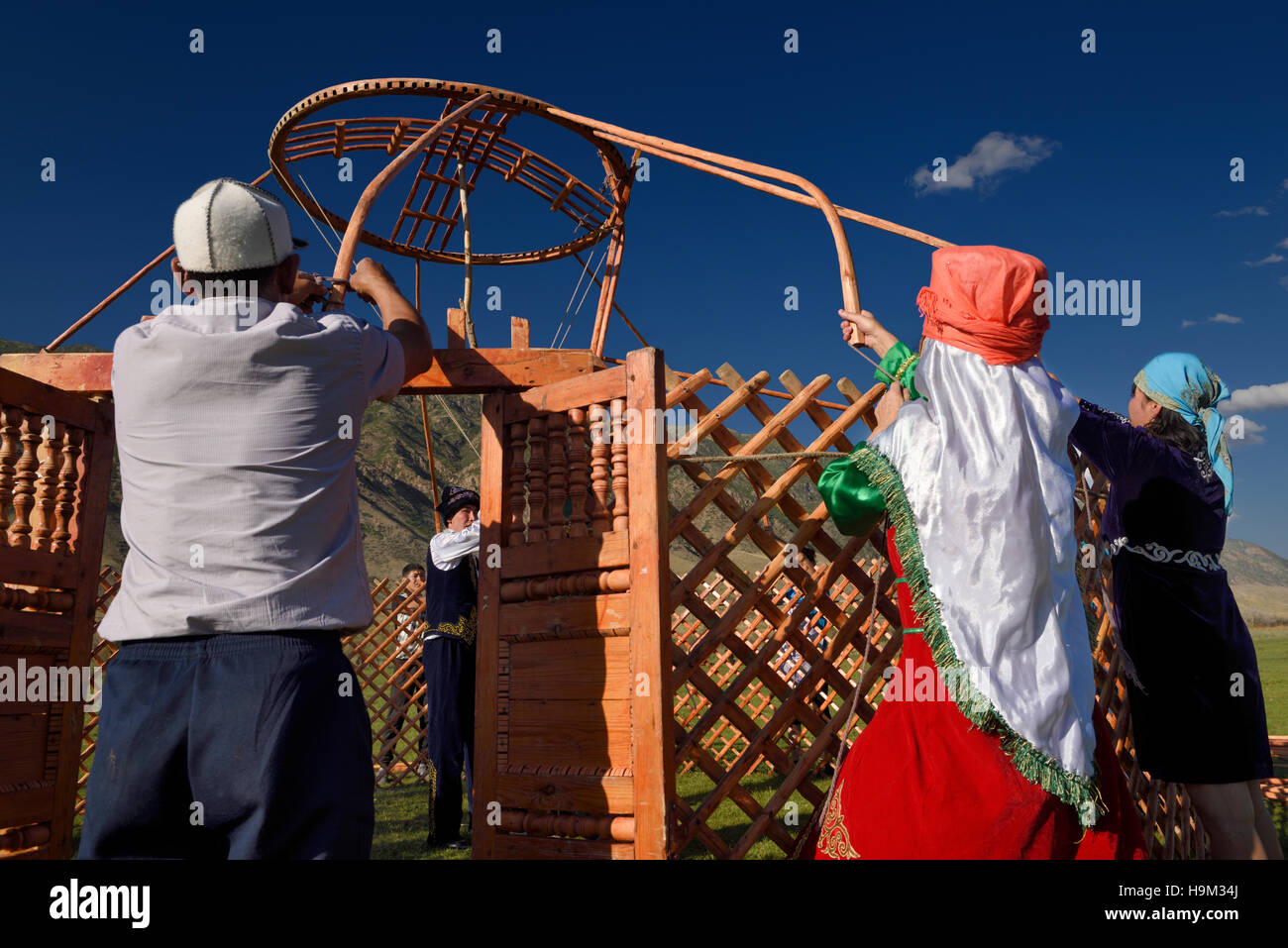 Saty villagers putting up a Yurt in Chilik river valley Kazakhstan Stock Photo