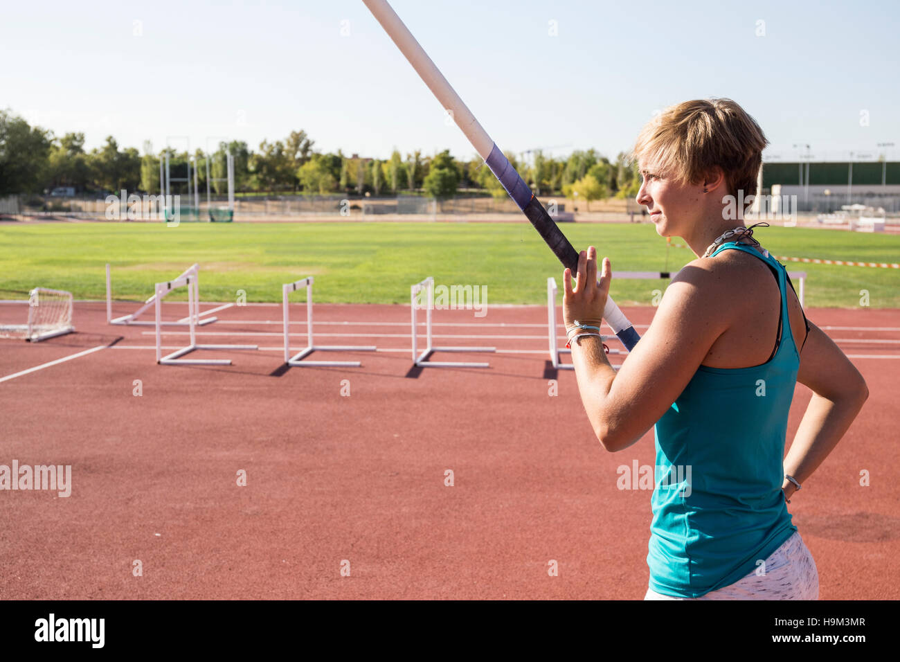 Female pole vaulter preparing Stock Photo Alamy