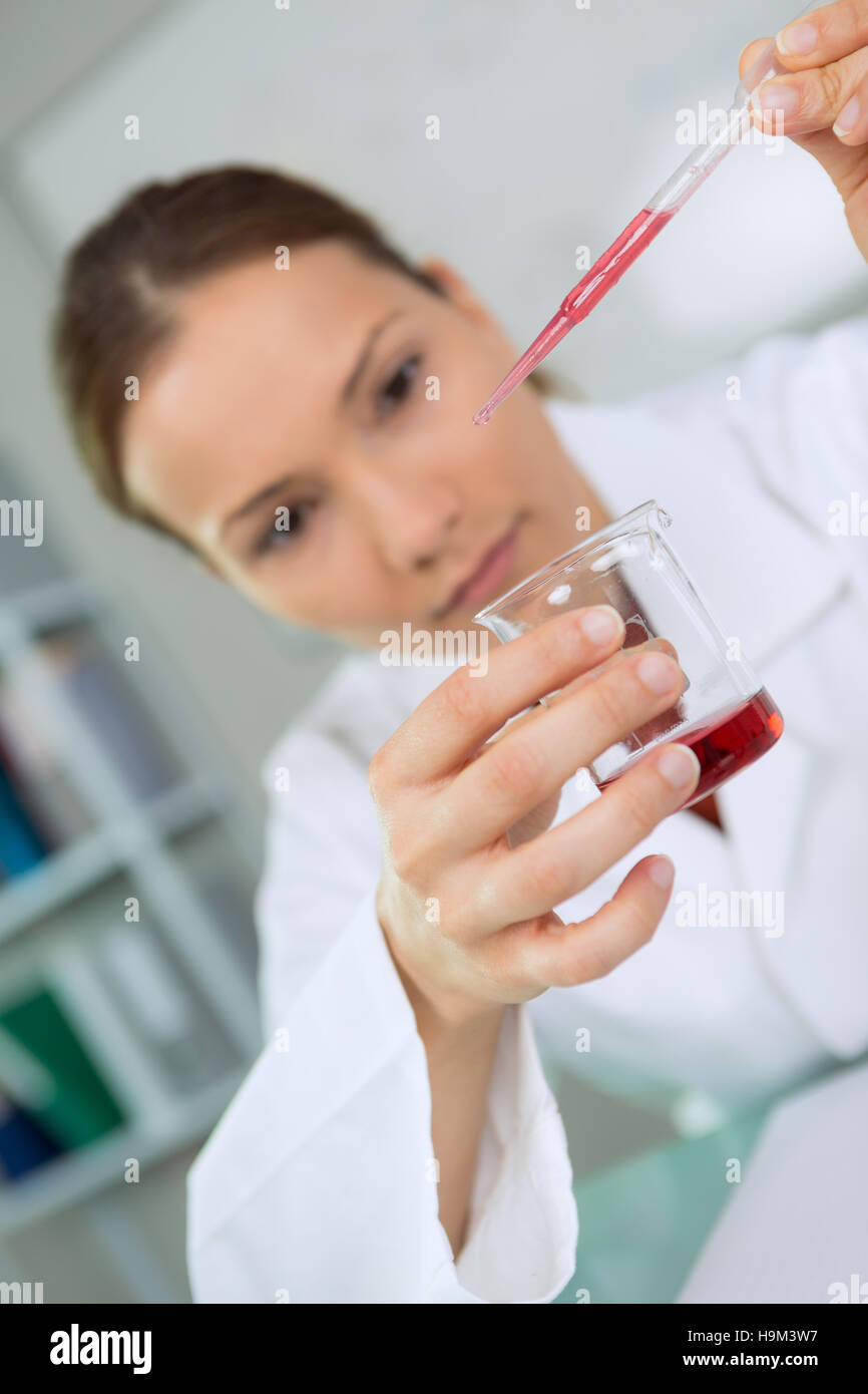 woman working with testing tubes of blood in a laboratory Stock Photo ...