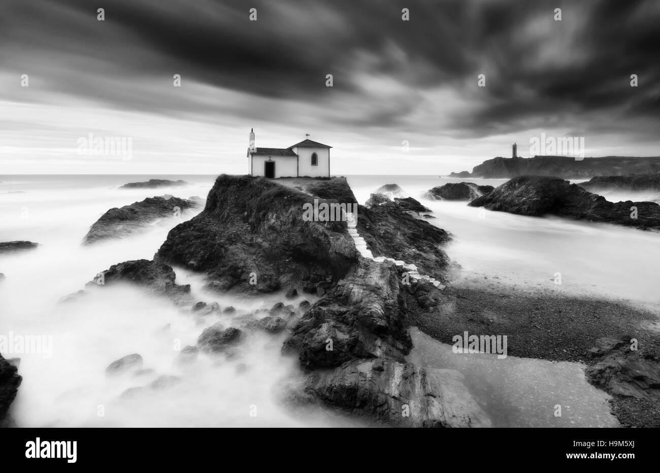 Spain, Valdovino, little chapel Virxe do Porto at the Galician coast, long exposure Stock Photo