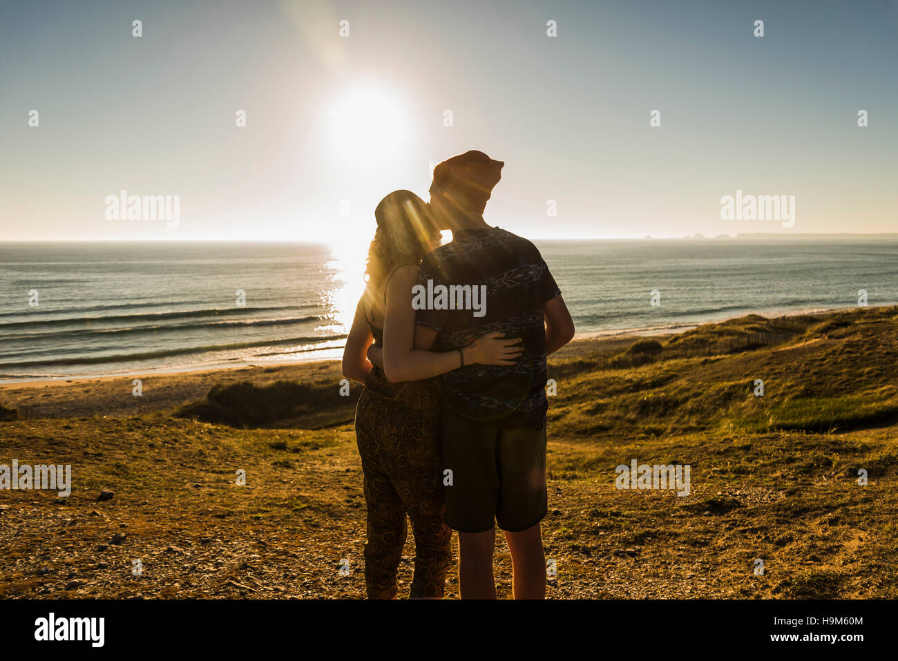 Back view of young couple at seaside at seaside Stock Photo