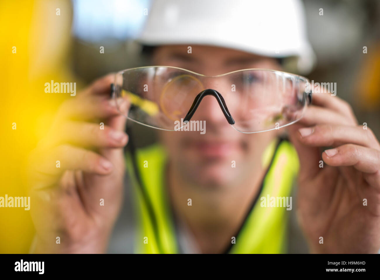 Man holding safety glasses Stock Photo Alamy