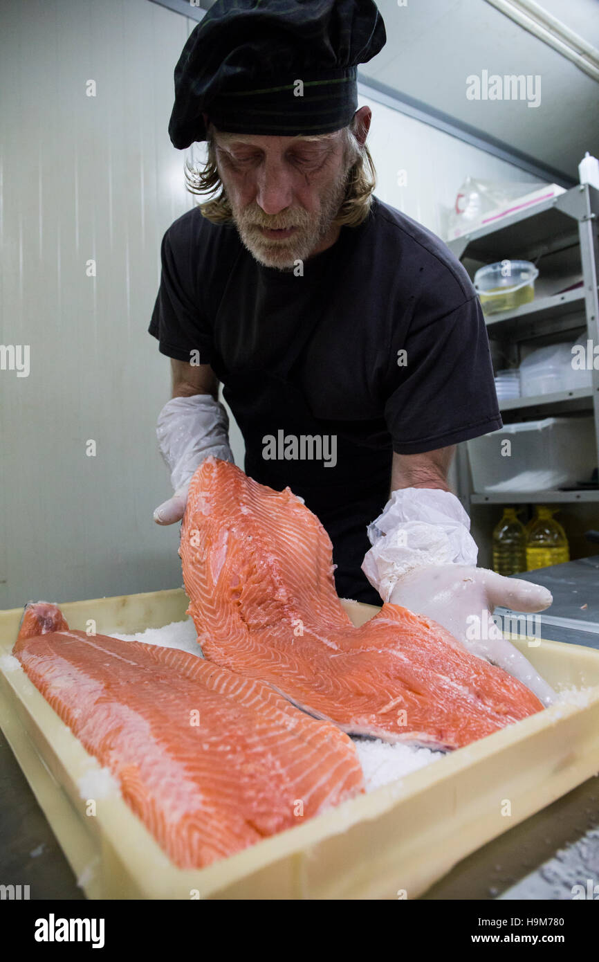 Fish smoker salting salmon before smoking Stock Photo Alamy