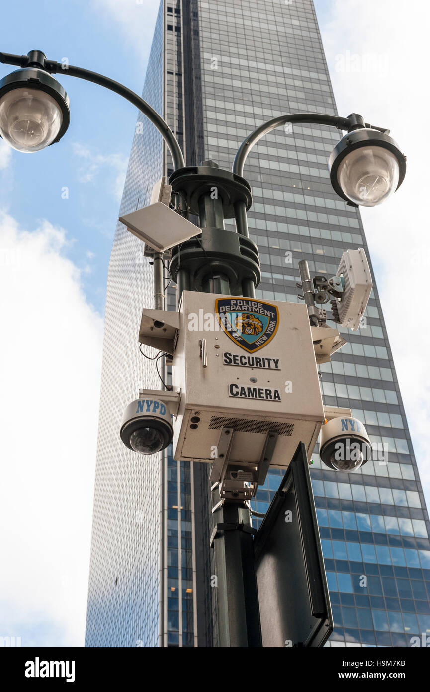 New York City Police street security cameras mounted in a pole with a skyscraper in the background / big brother is watching you Stock Photo