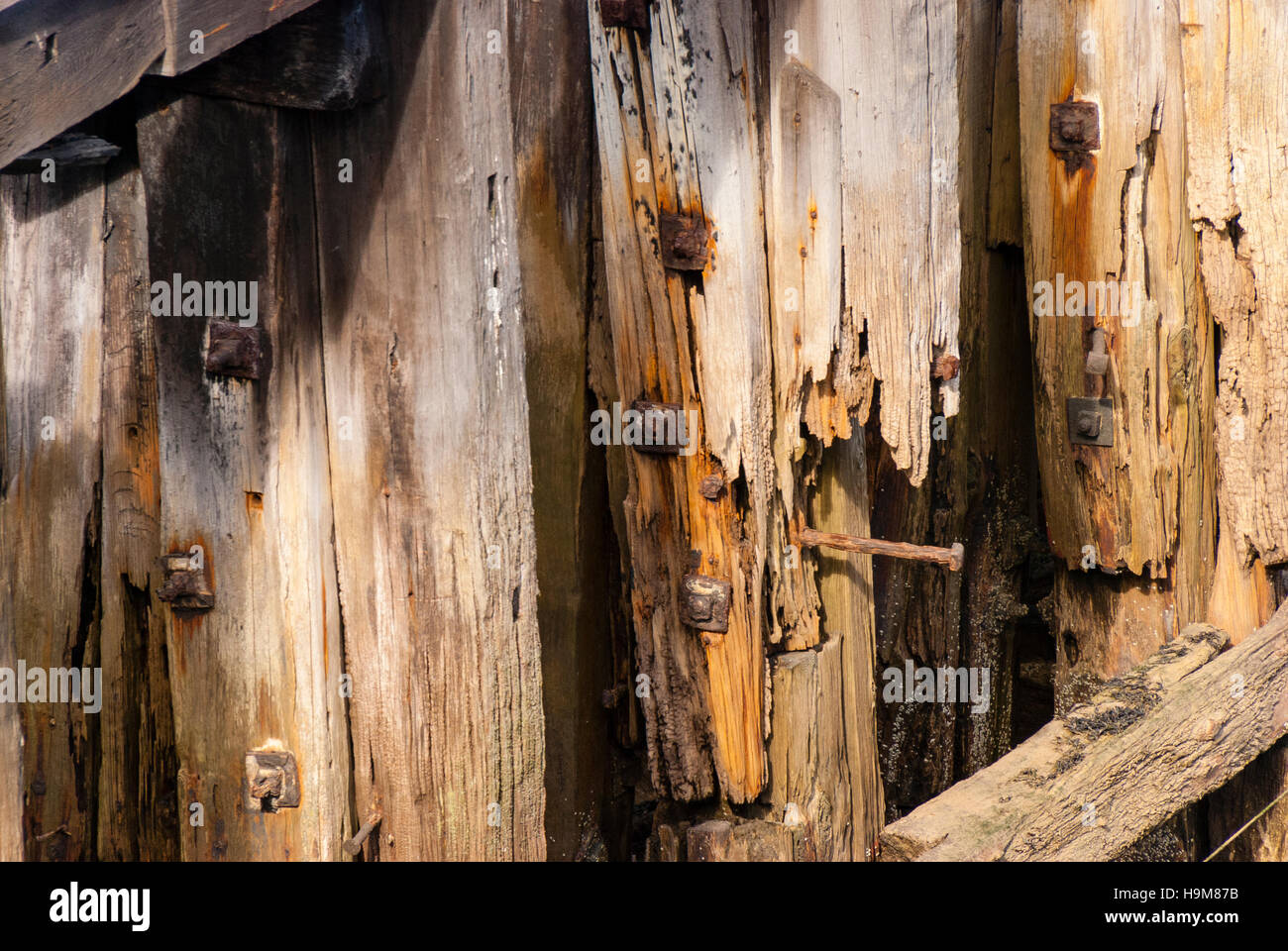A decaying wooden pier close up background Stock Photo