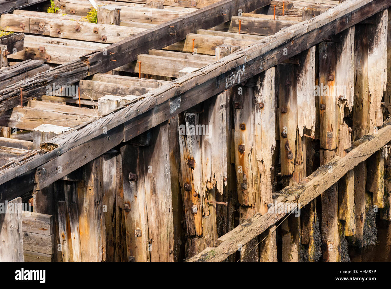 A close up of a decaying wooden pier background Stock Photo