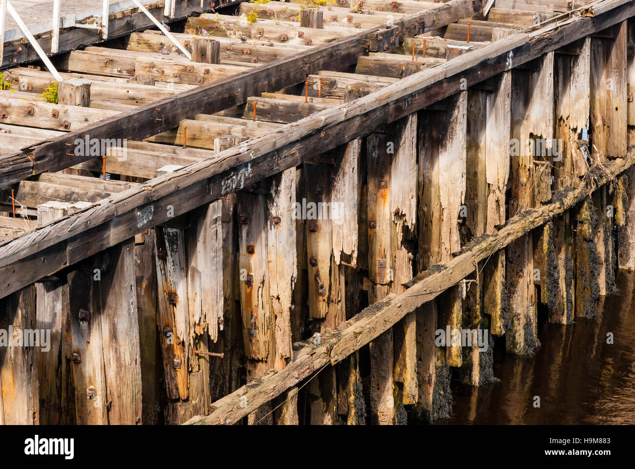 A decaying wooden pier background Stock Photo