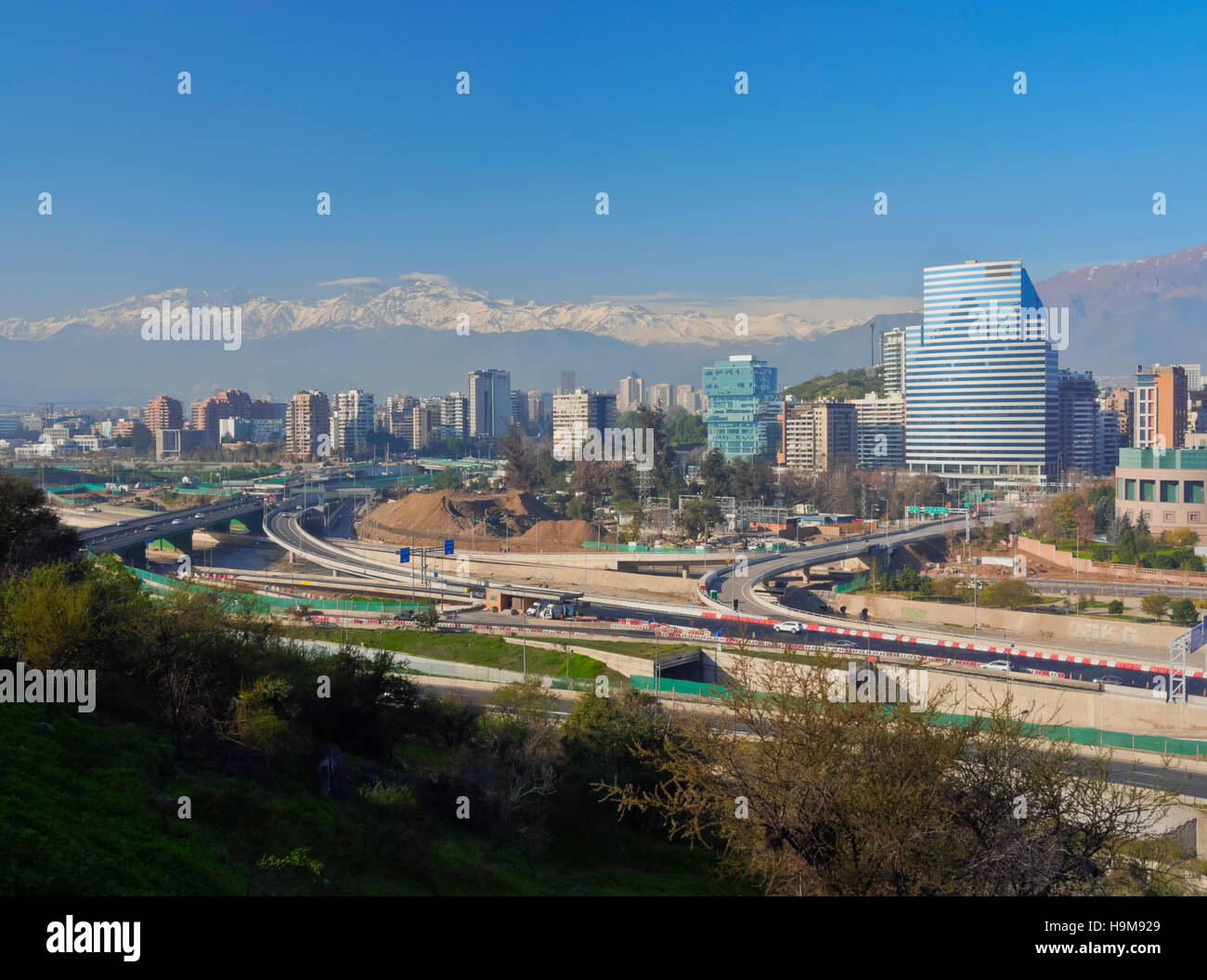 Chile Santiago View from the Parque Metropolitano towards the high raised buildings in financial sector. Snow covered Andes in Stock Photo