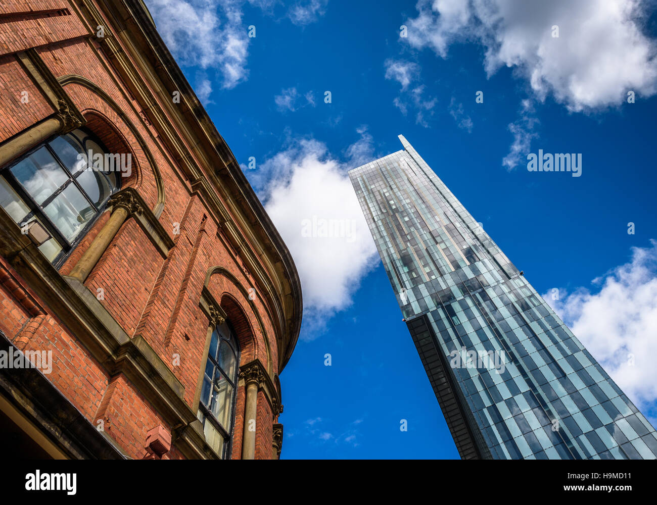 Beetham Tower, the tallest building in Manchester juxtaposed against a Victorian red brick building. Stock Photo
