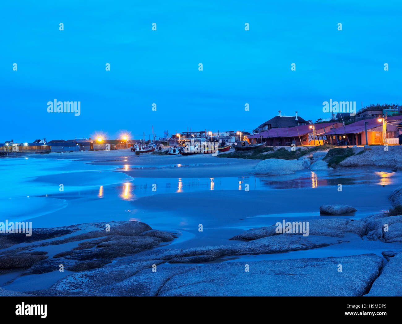 Uruguay, Rocha Department, Punta del Diablo, Twilight view of the Fisherman’s Beach Los Botes. Stock Photo