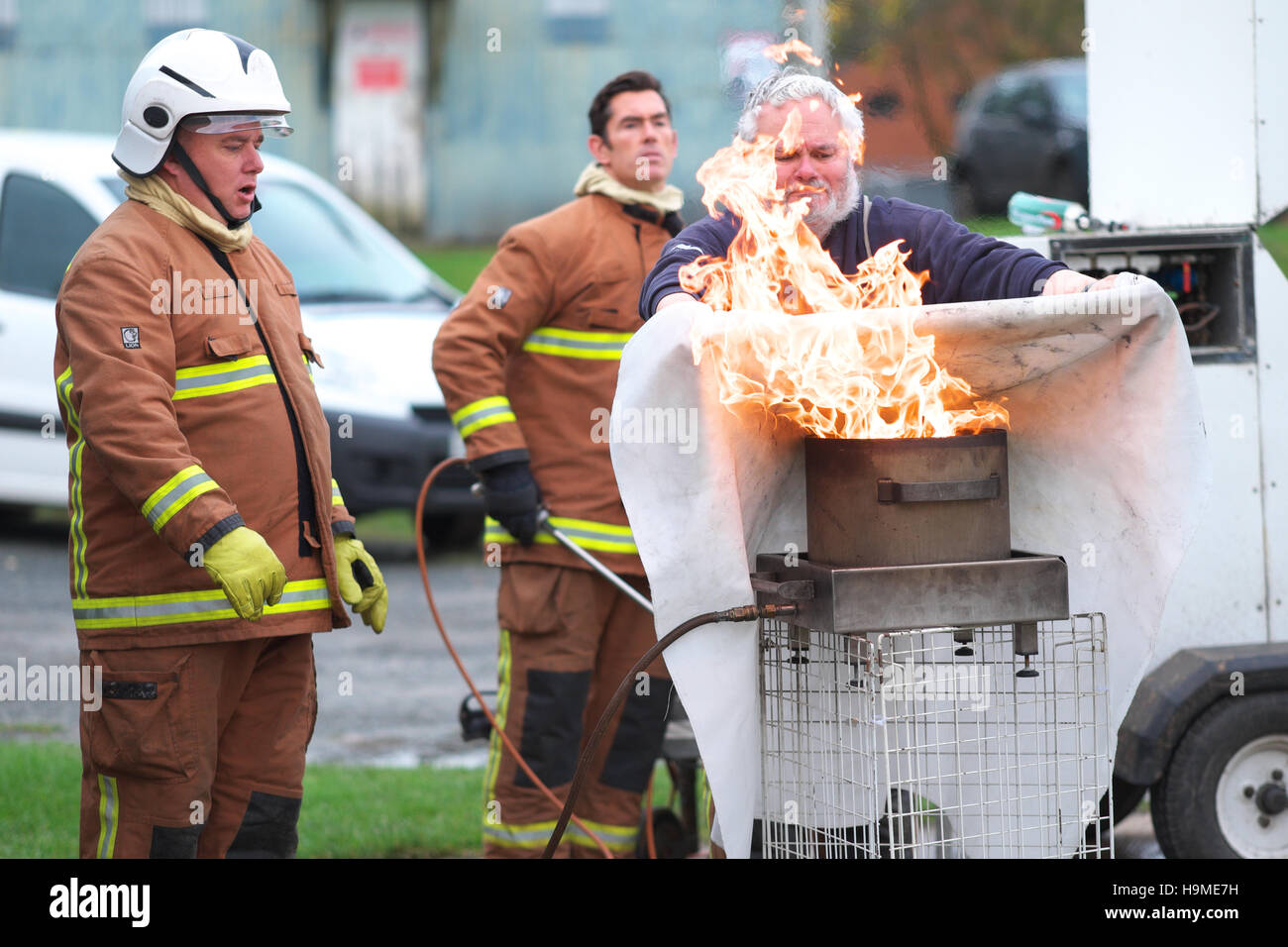 Health and Safety on site fire training using a fire blanket to