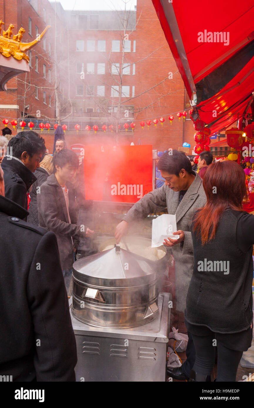 Chineses street food seller in Chinatown LOndon diuring the new year celebrations Stock Photo